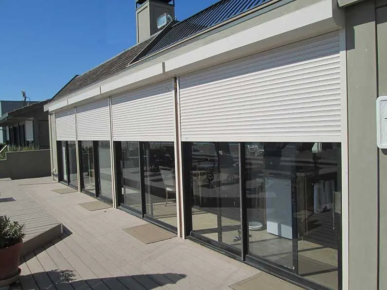 Exterior rolling shutters fitted to a building